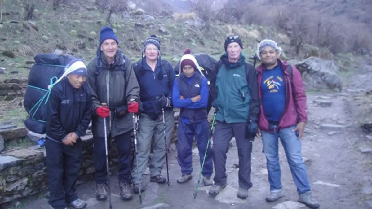 Trekkers on Annapurna Base Camp trekking with a guide, and a porter 