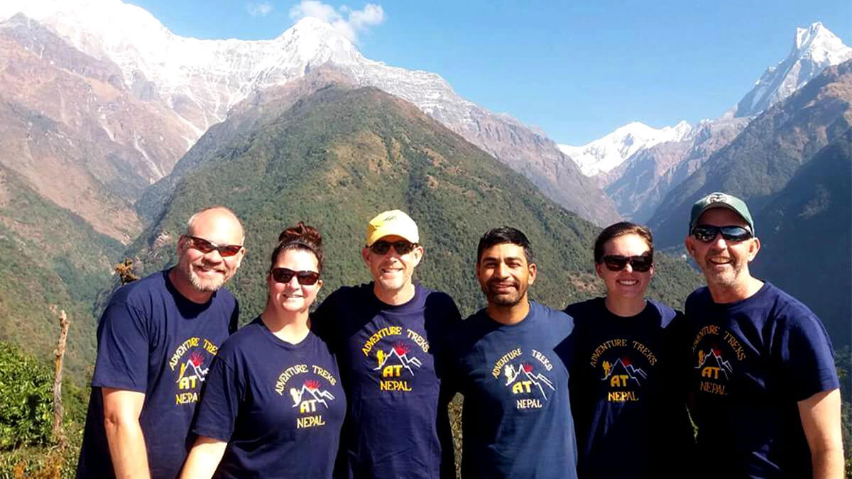A team enjoying dramatic scenery while gaining elevations on Annapurna Base Camp Trek