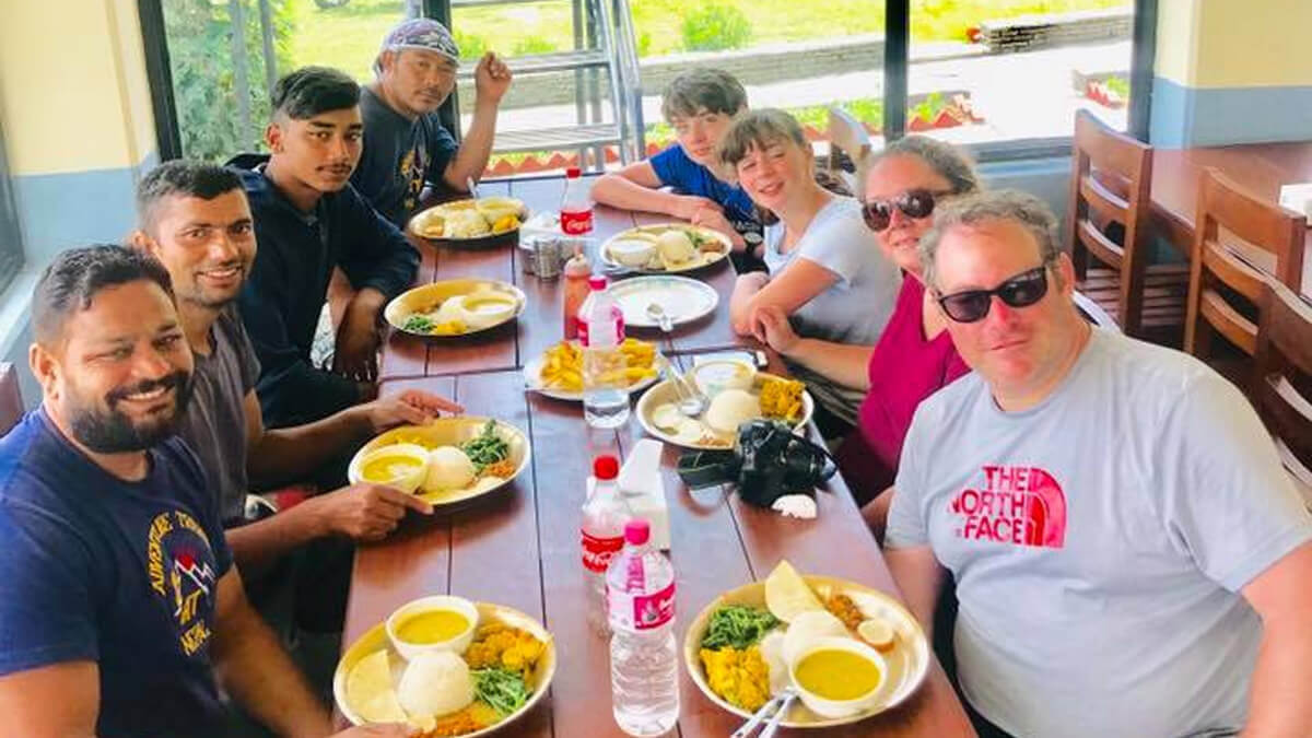 Team enjoying delicious "Dal Bhat" during Annapurna Base Camp Trek
