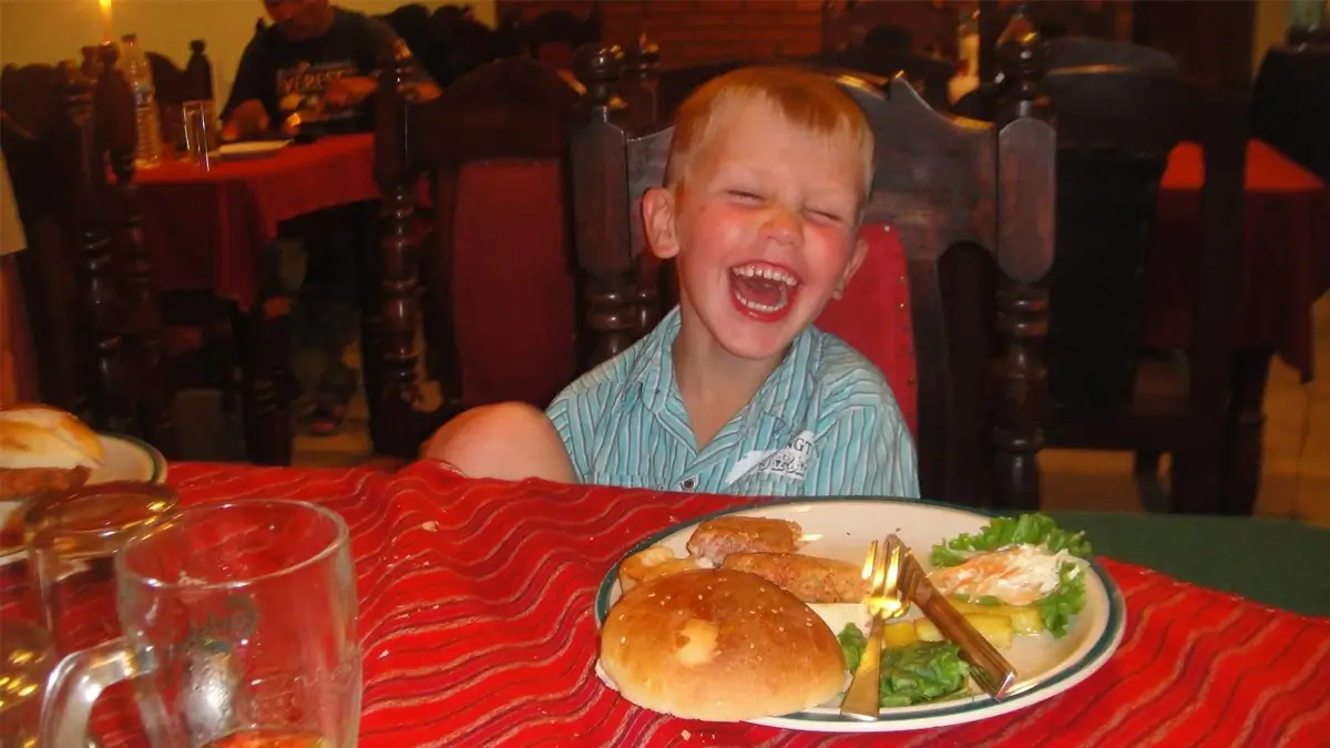 A baby having food at teahouse during the Annapurna Base Camp Trek 